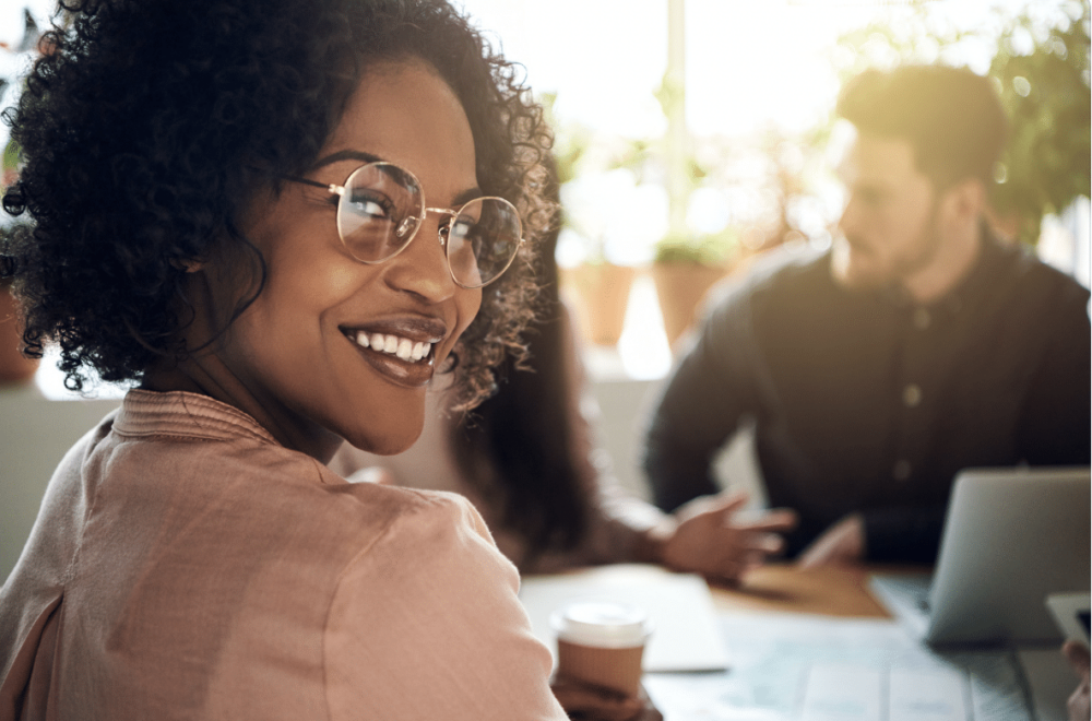 portrait of black female employee among coworkers